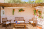 The living area opens to this furnished terrace
